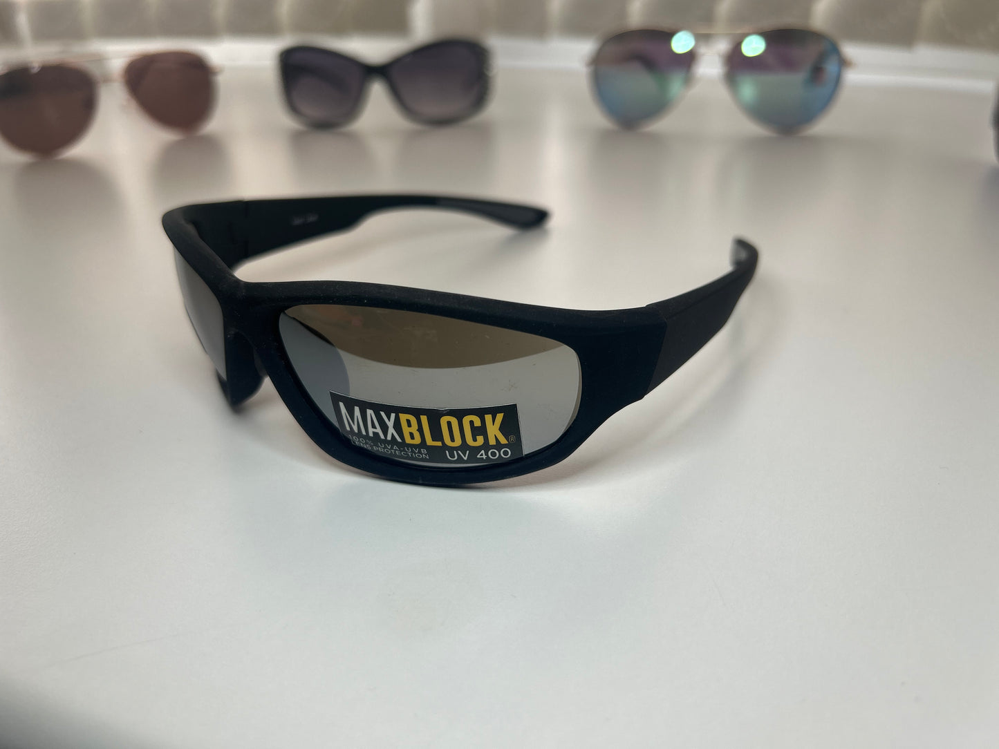 Foster Grant sunglasses in the image are the Bloc Delta X4 model, designed as a stylish, sporty option for active lifestyles